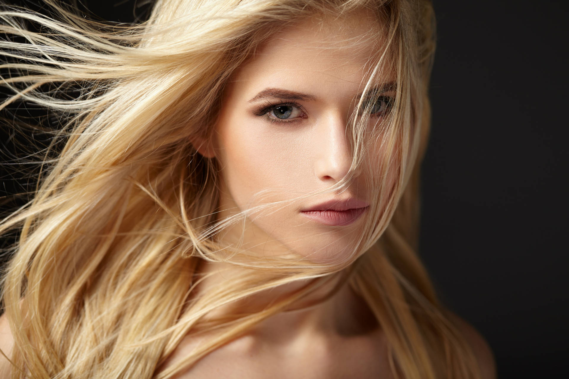 Enchanting Beauty: Radiant Blonde With Fair Skin And Alluring Eyes Background