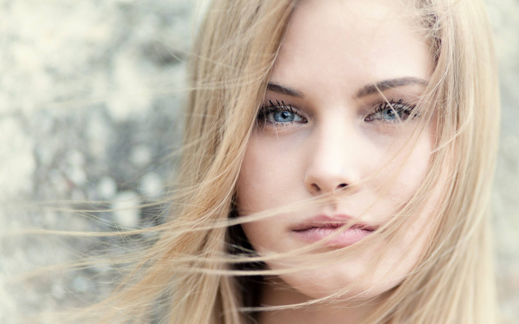 Enchanting Blonde Woman Face Background