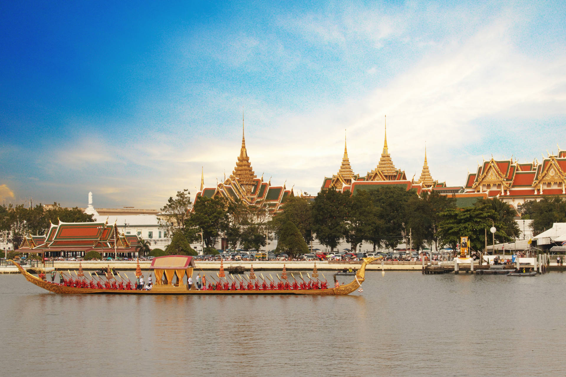 Enchanting Chao Phraya Boat Ride In Bustling Bangkok Background