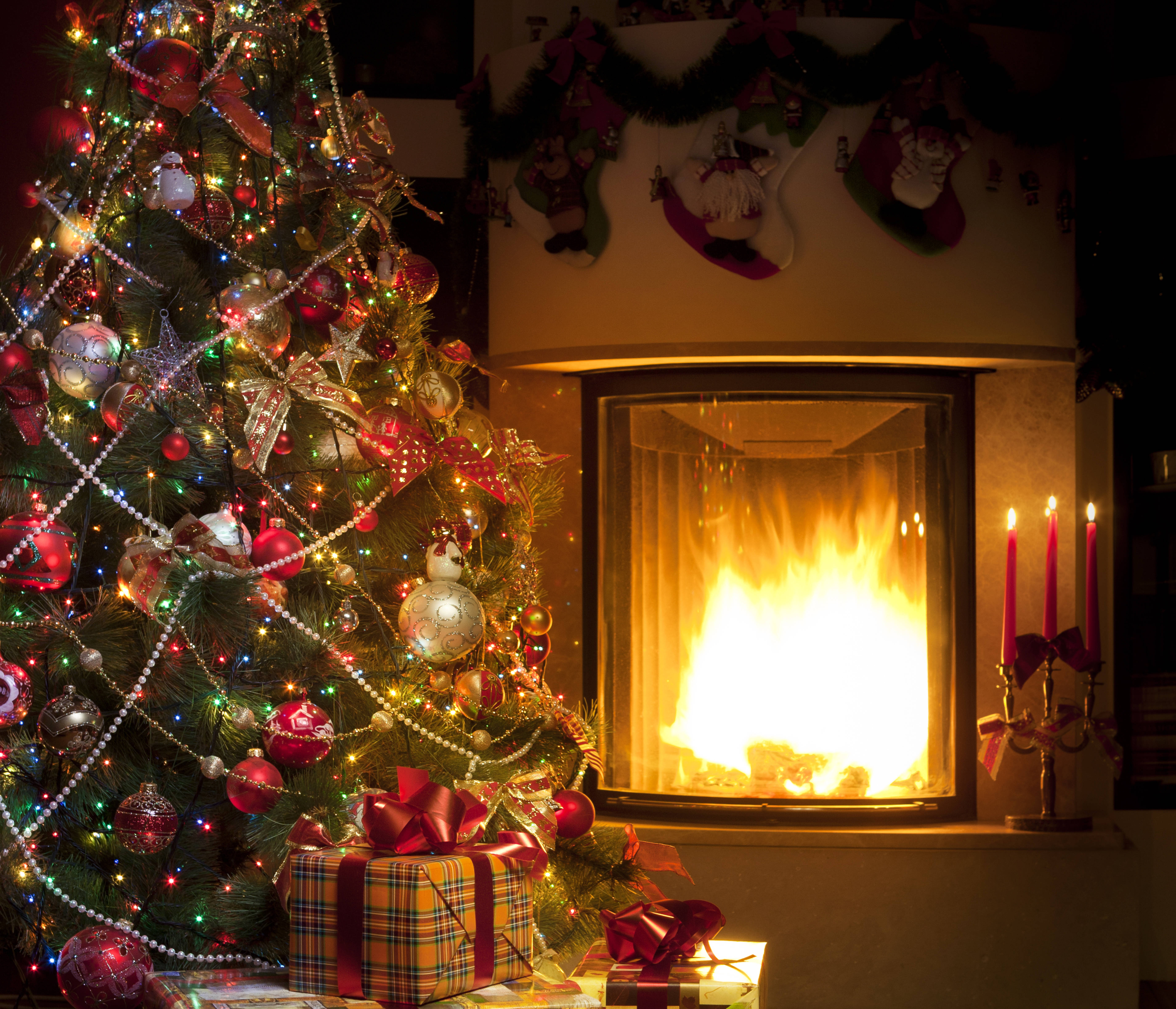 Enchanting Fireplace Christmas Setup On A Cool Winter Night Background