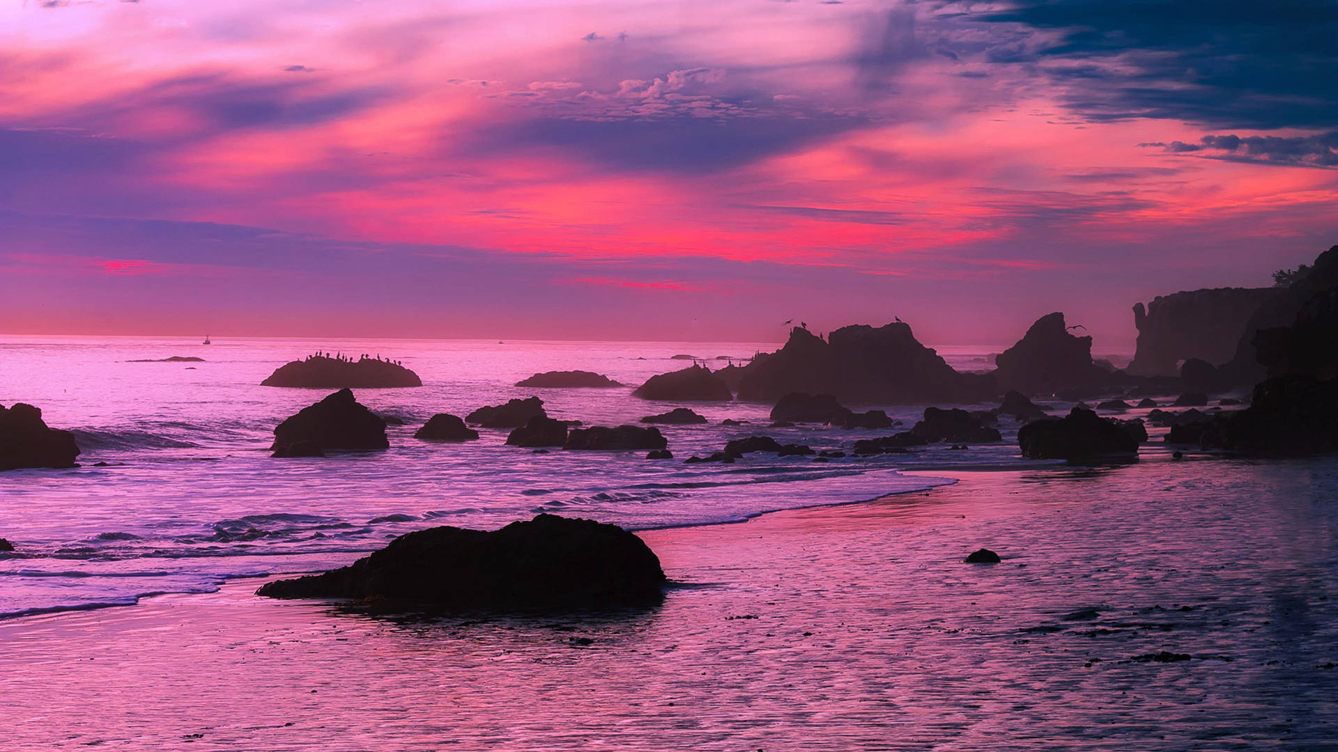 Enchanting Malibu Beach At Dusk Background