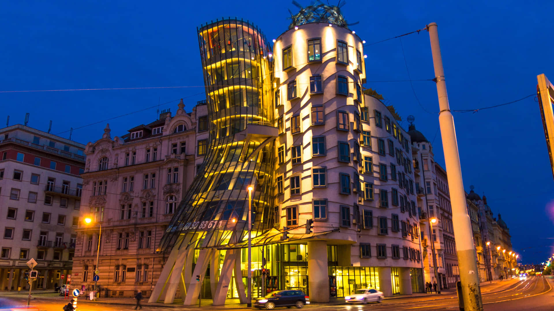 Enchanting Night View Of Dancing House In Prague Background