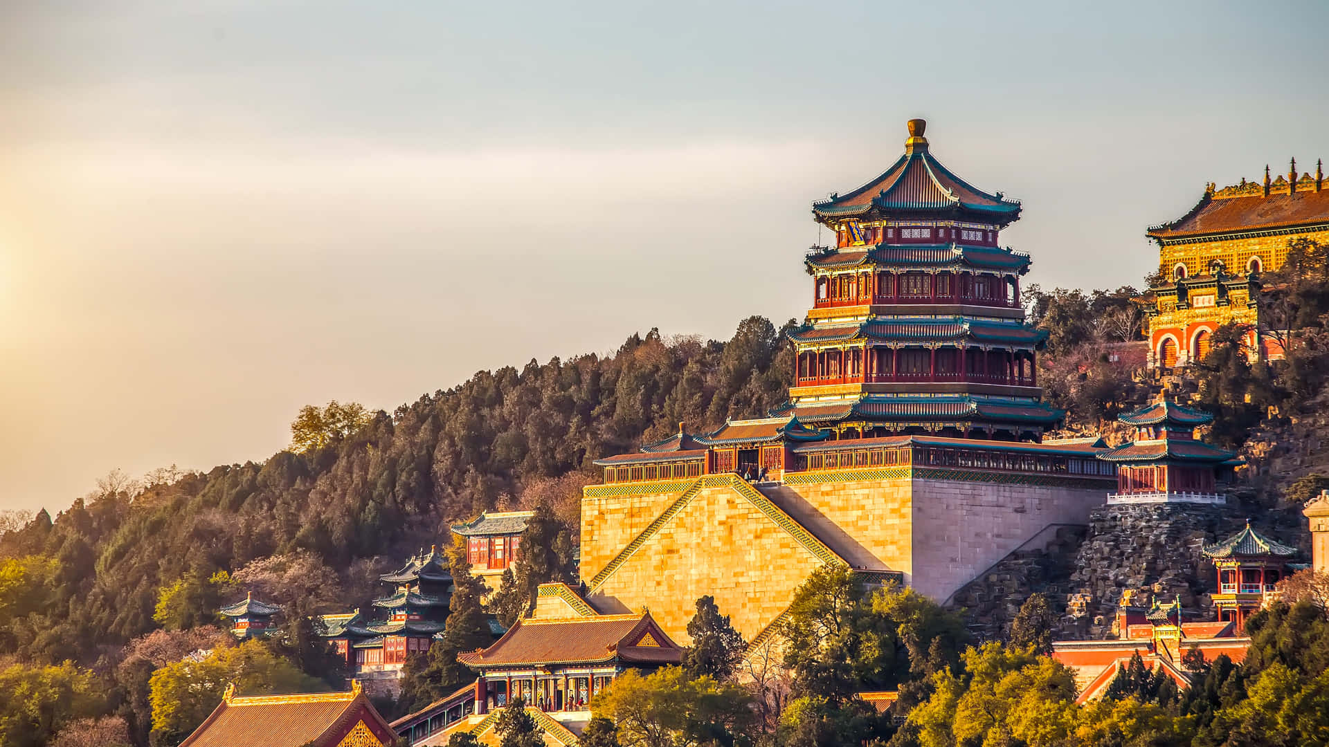 Enchanting Summer Palace Surrounded By Lush Green Trees Background