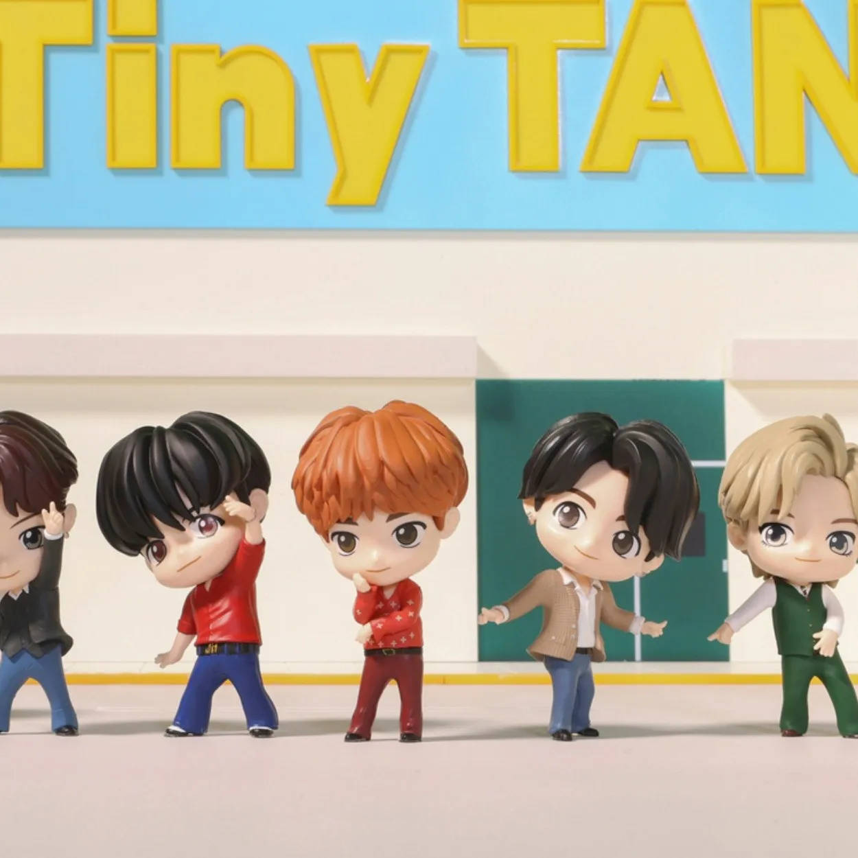 Enchanting Tiny Tan Bts Dolls In Action Background