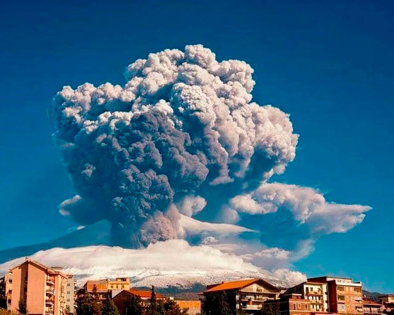 Enchanting View Of Sicilian Village With Mount Etna In Background Background