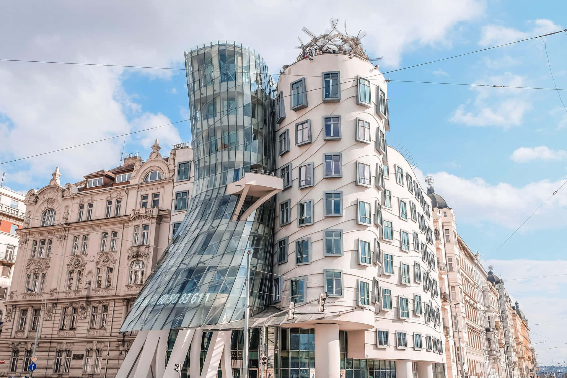 Enchanting View Of The Dancing House In Prague Under The Cloudy Blue Sky Background