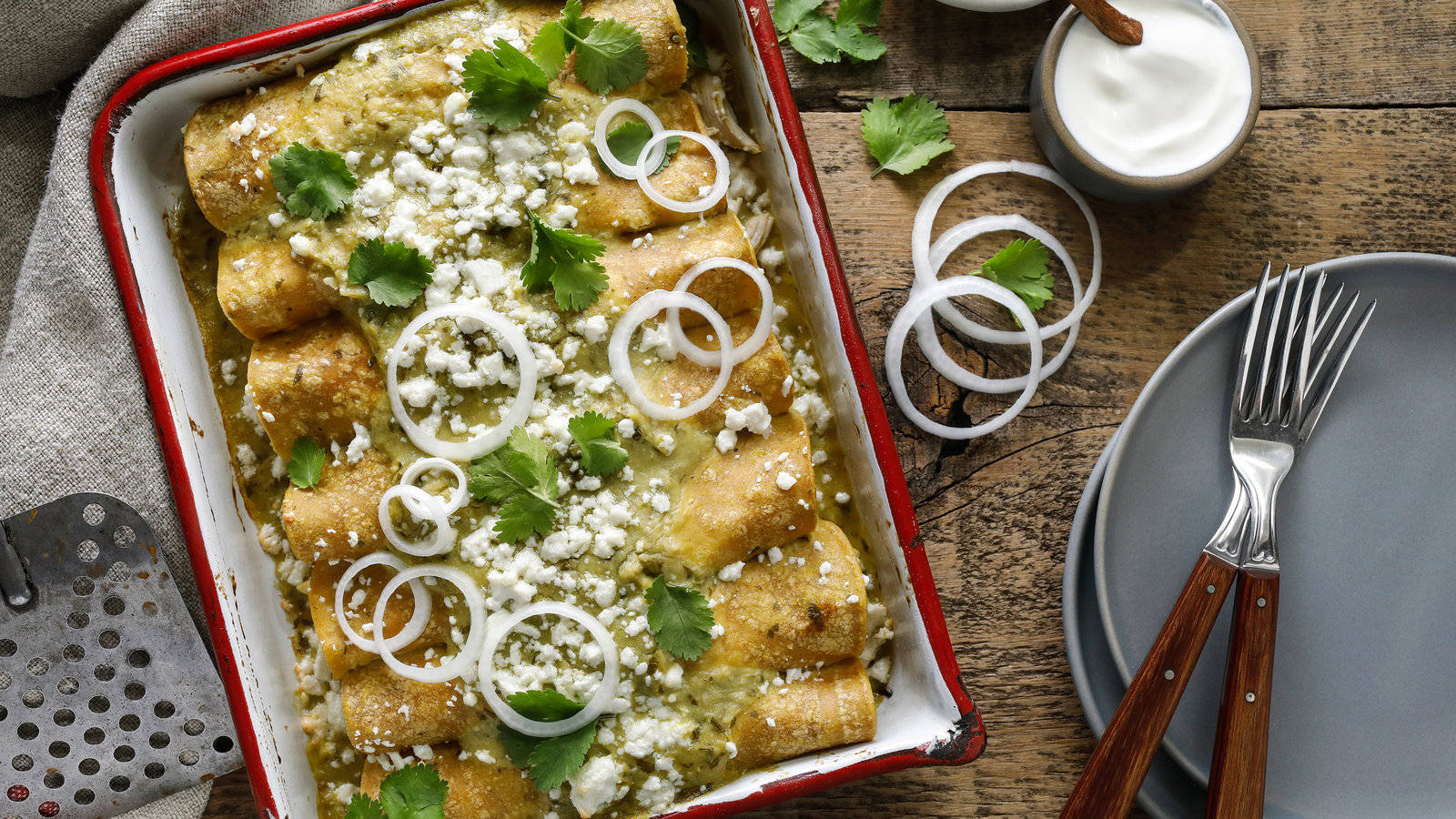 Enchiladas Tray Topped With Onion Rings Background