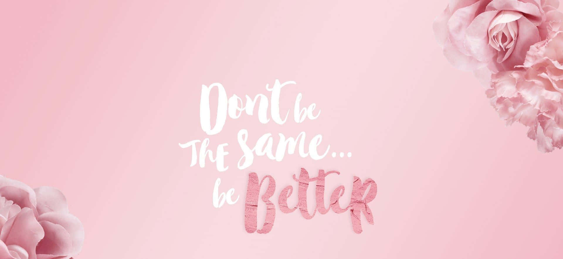 Encouraging Quote On Rose Gold Laptop Background