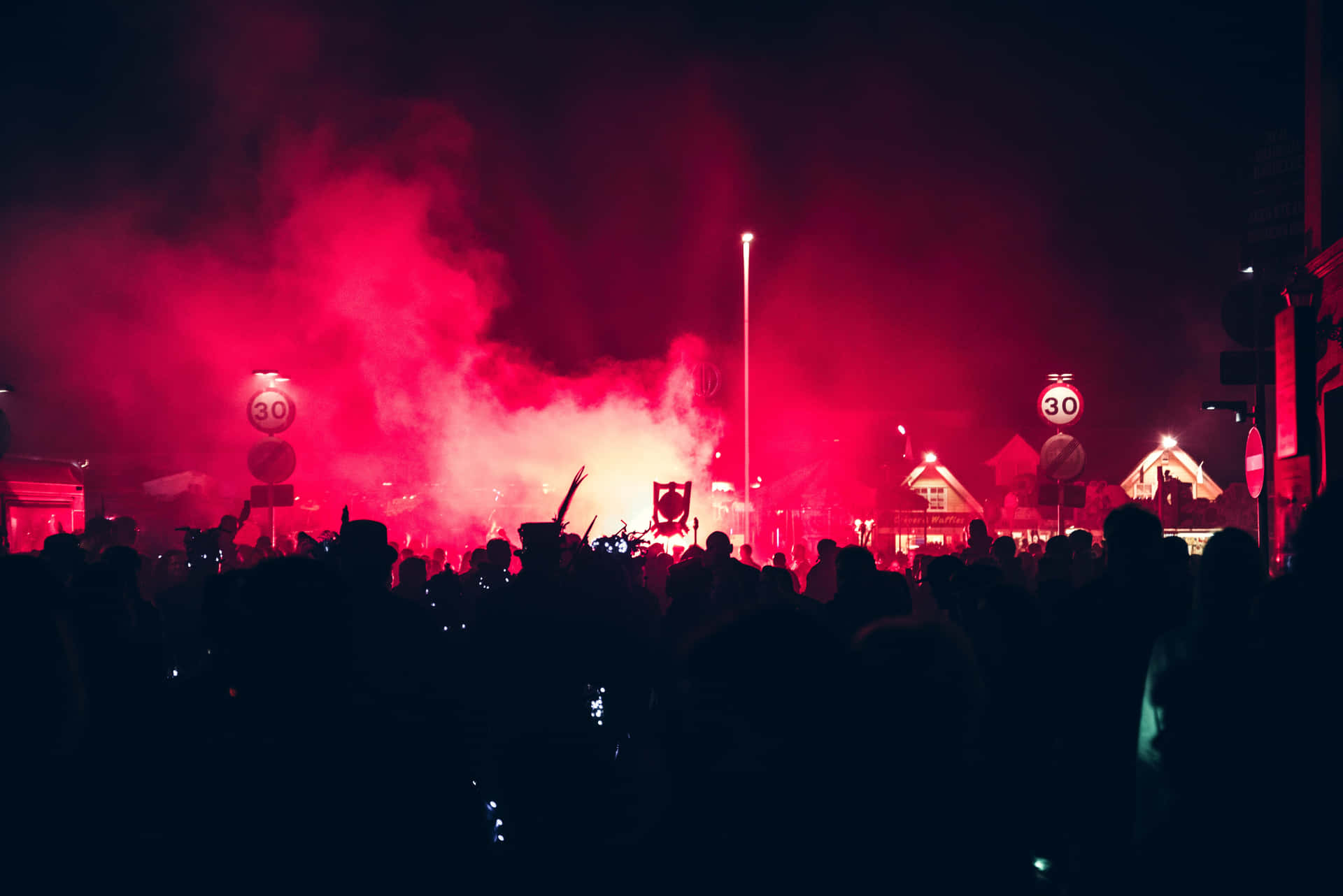 Energetic Crowd Enjoying A Live Music Festival At Night