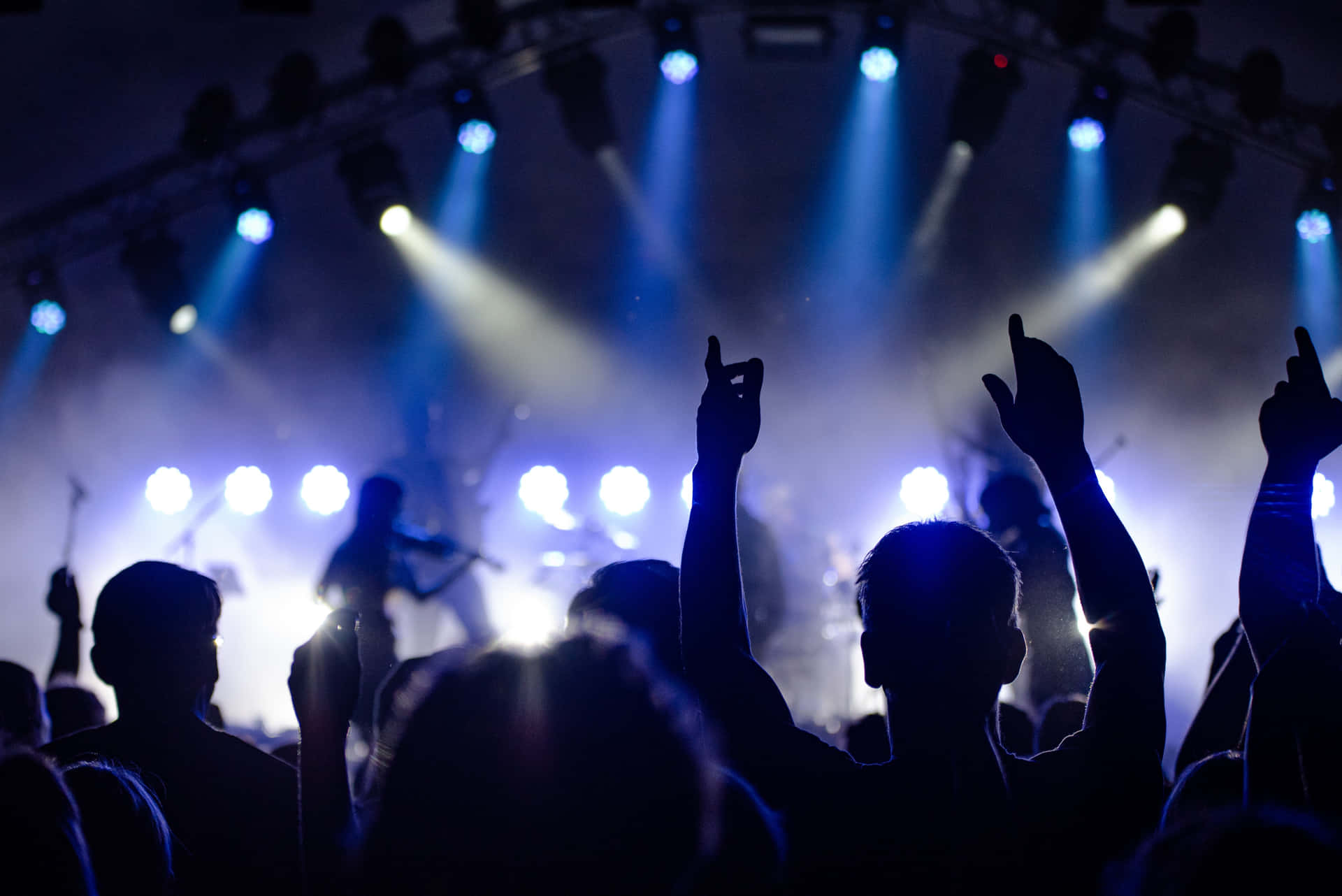 Energetic Crowd Enjoying An Unforgettable Music Festival Background