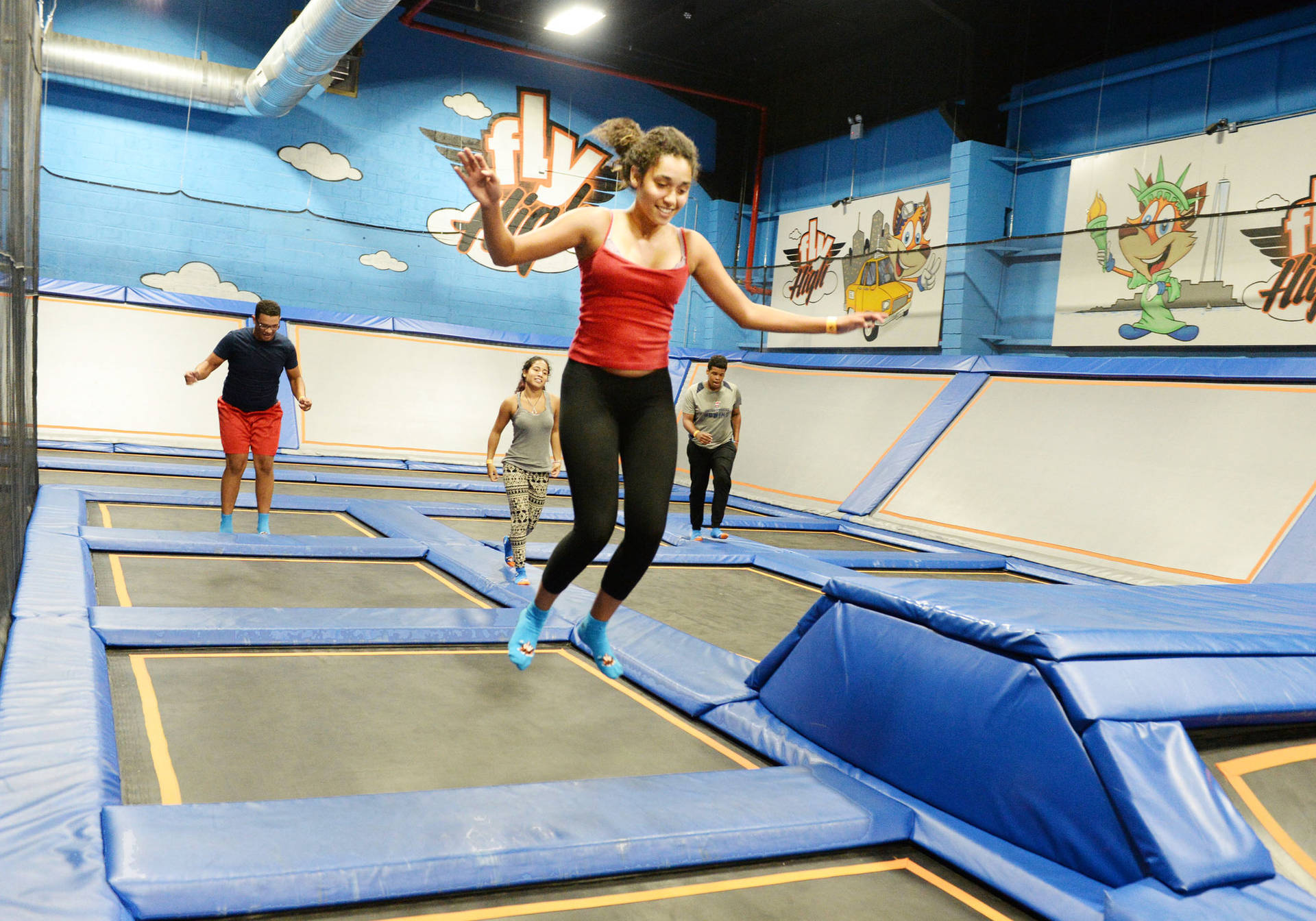 Energetic Fun At Indoor Trampoline Park Background