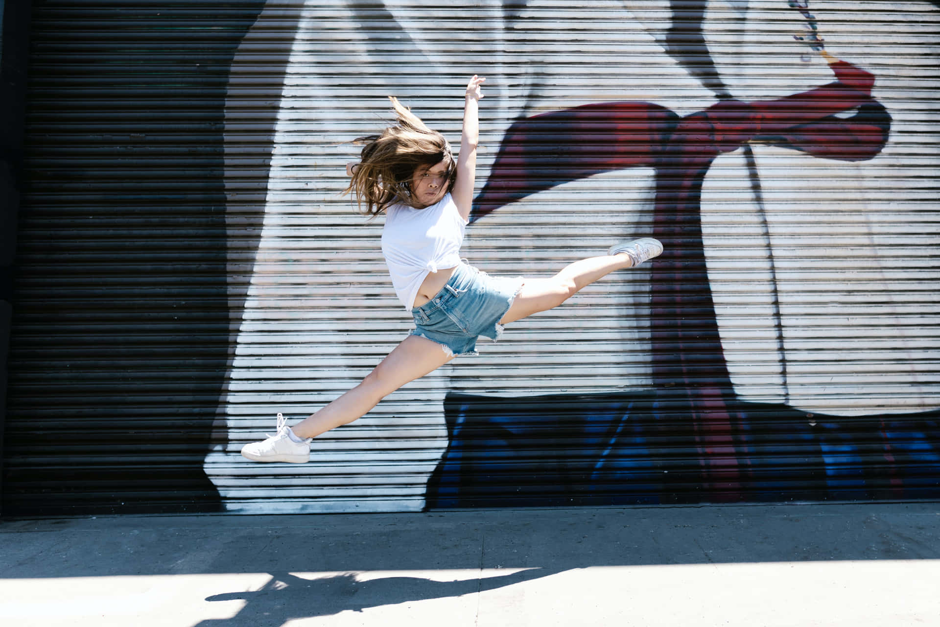 Energetic Leap In Mid-air Background