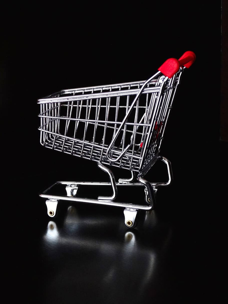 Energetic Shopper Making A Purchase Background