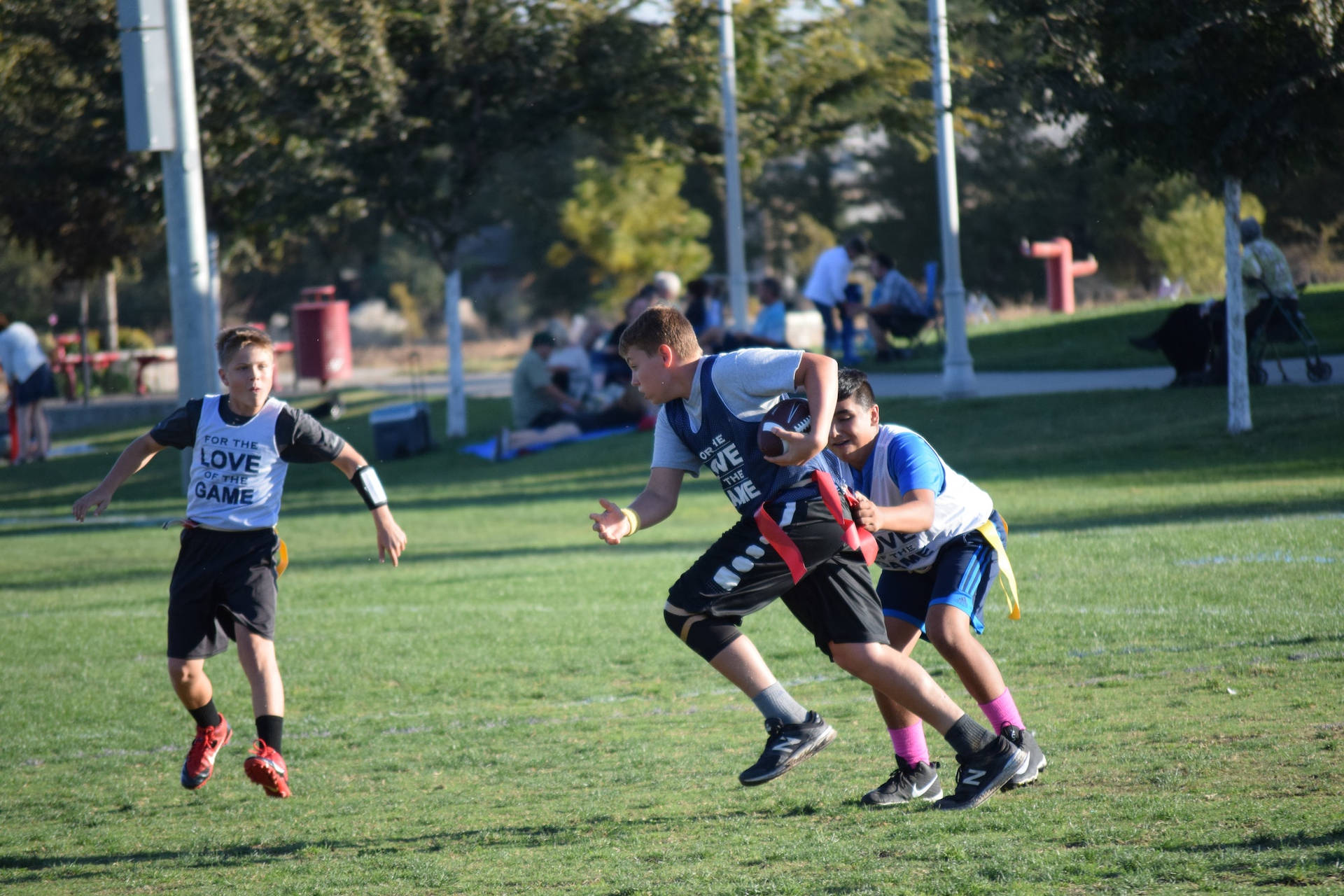 Energetic Young Players In An Exciting Flag Football Match