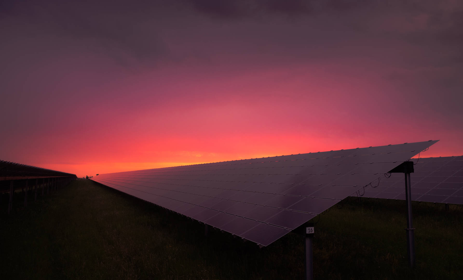 Energy Panels Under A Rosy Sky Background