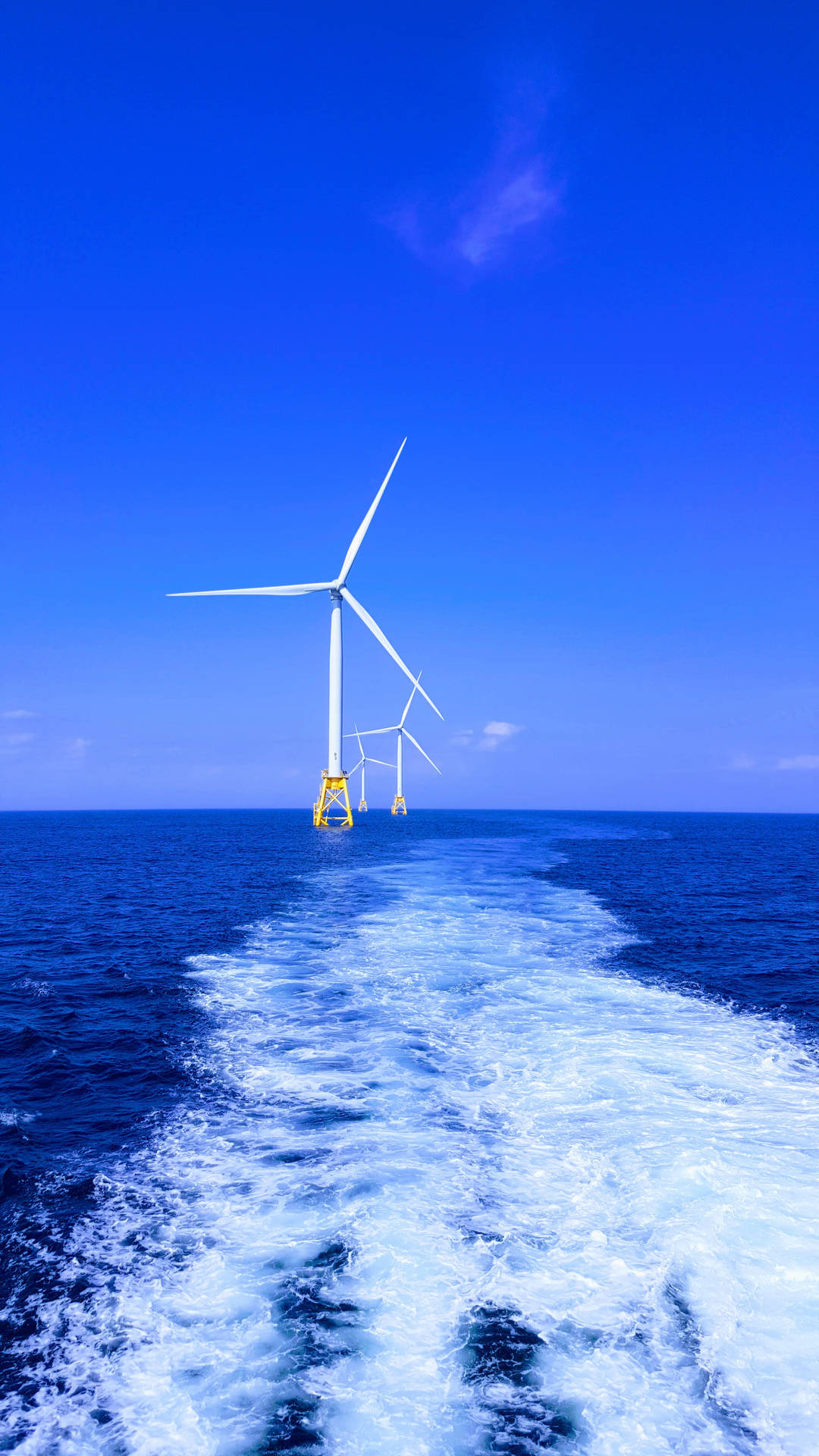 Energy Windmills Floating On Sea Background