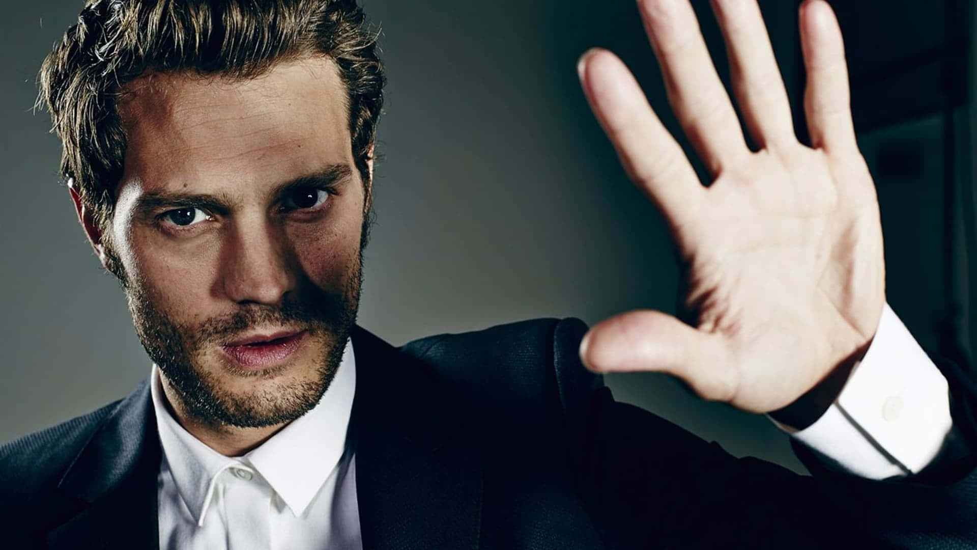 Engaging Portrait Of Jamie Dornan Background