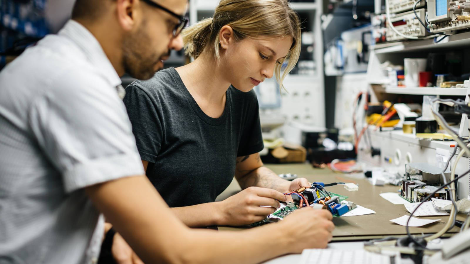 Engineers Fixing Electronic Components