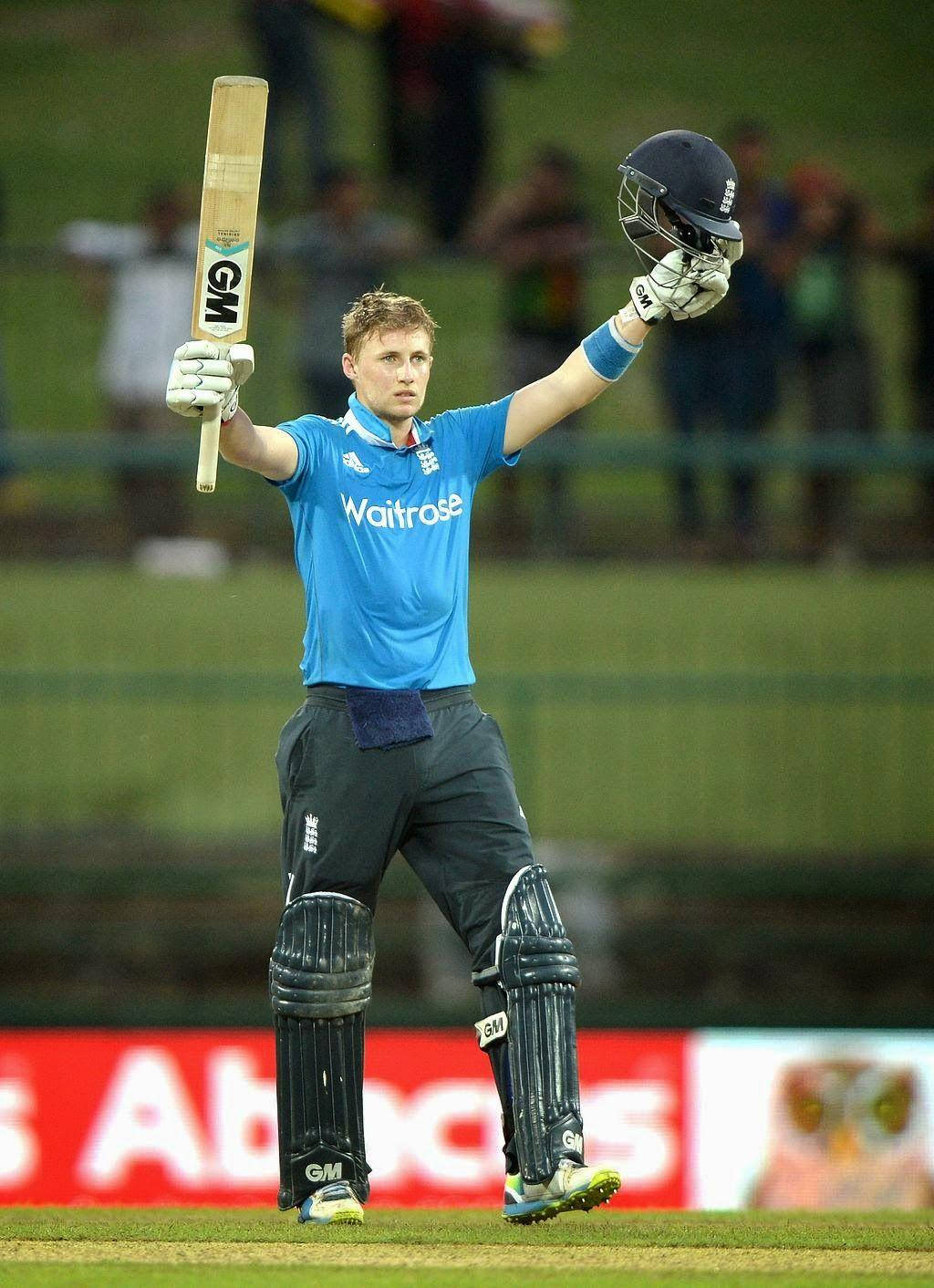 England Cricketer Joe Root Celebrating A Victory Background