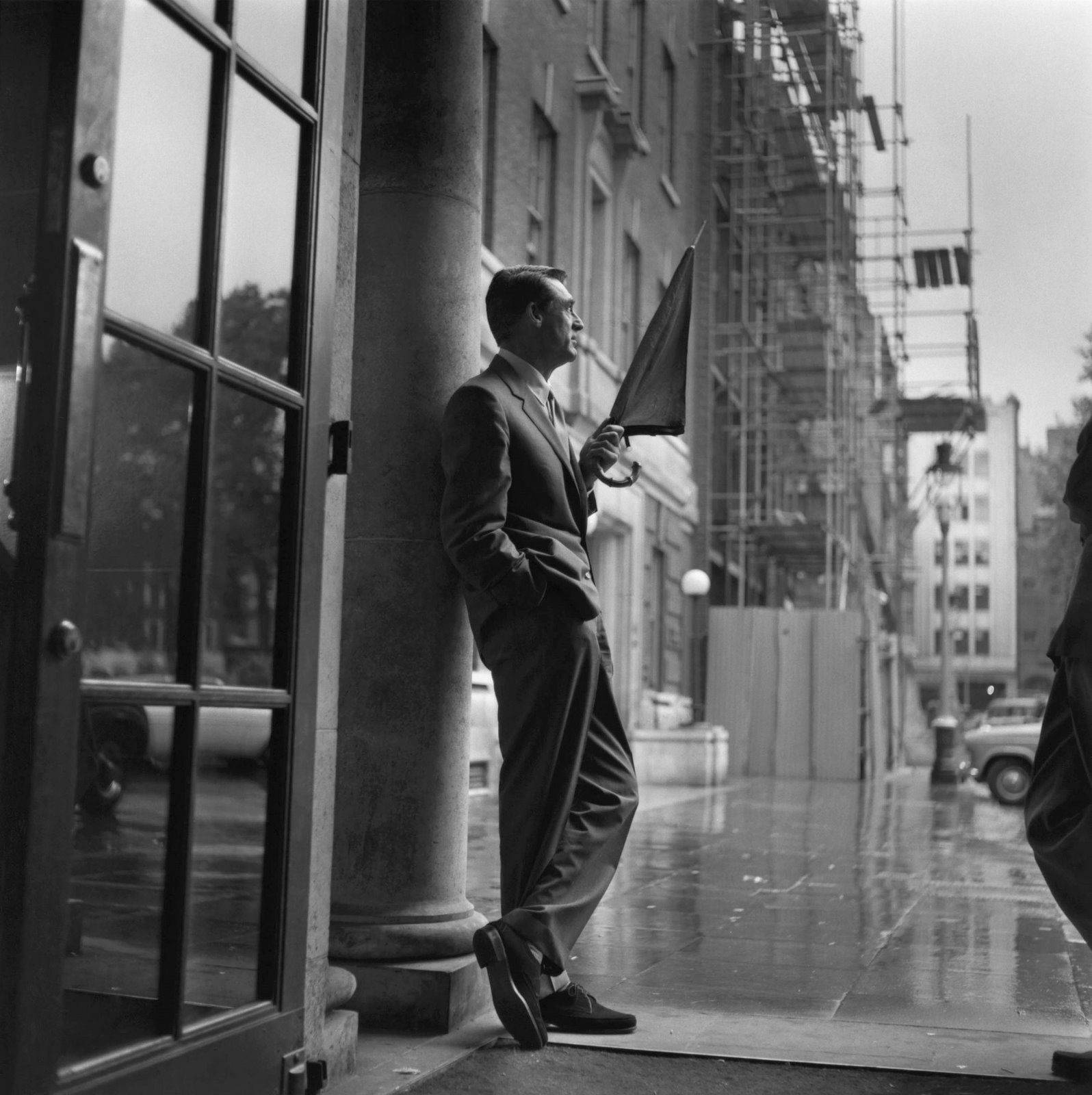 English-american Actor Cary Grant In Rain Background