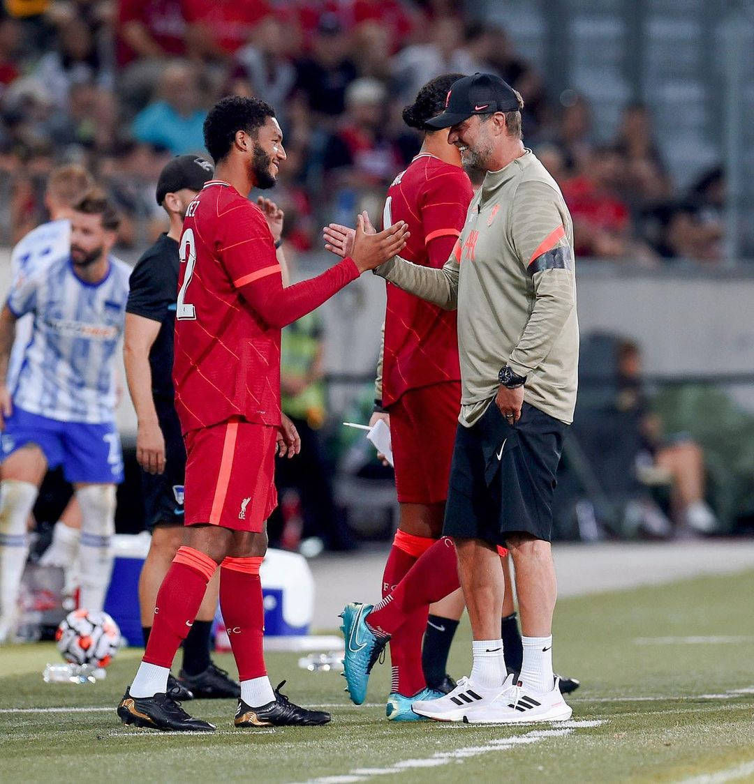 English Footballer Joe Gomez Performing A Handshake