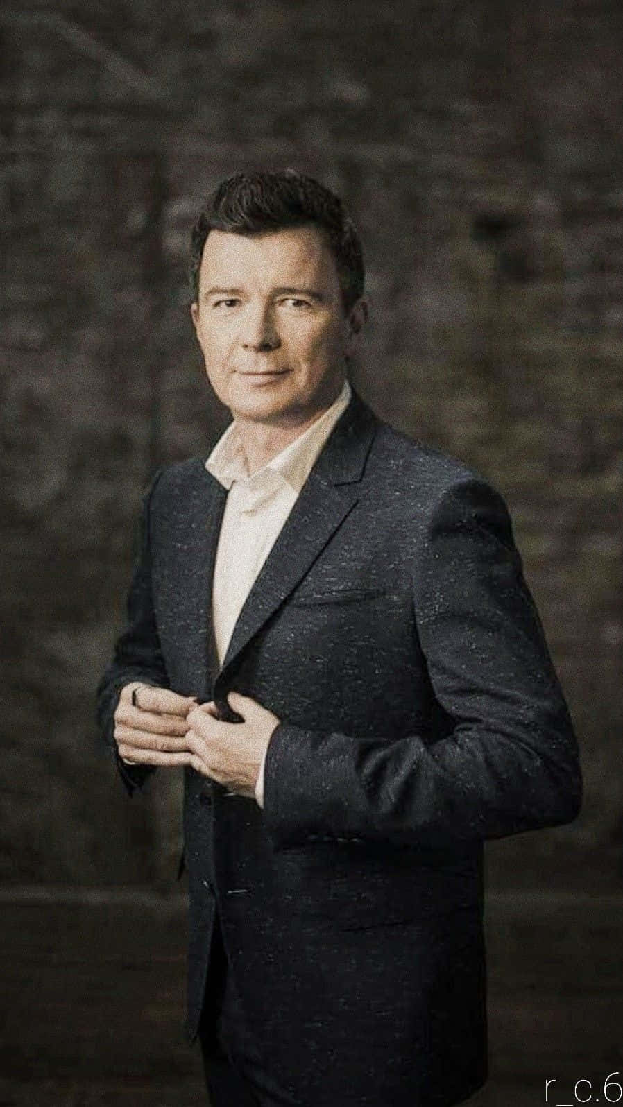 English Musician Rick Astley Performing On Stage