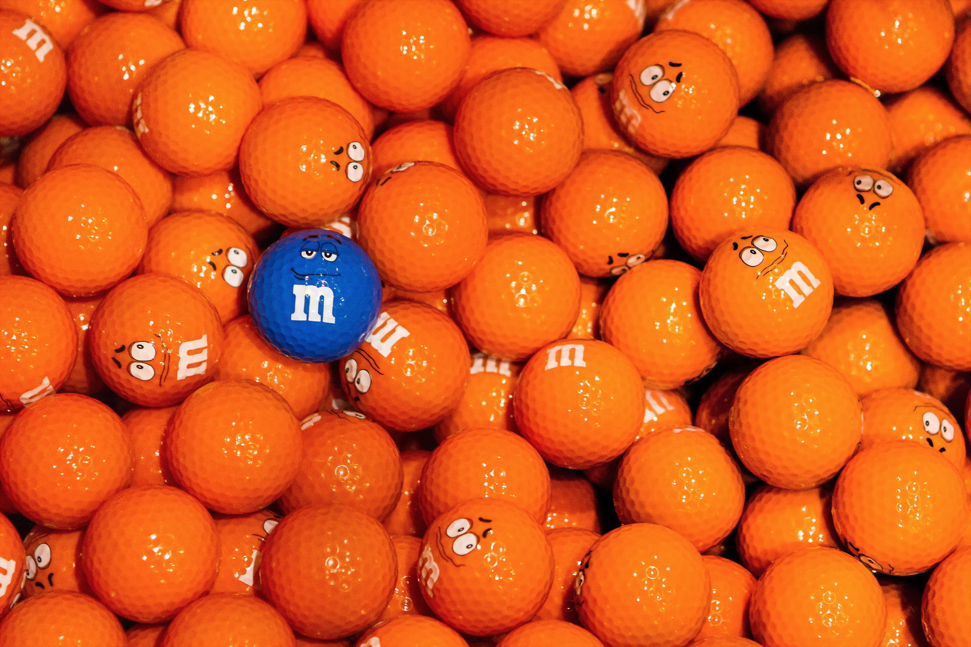 Enhance Your Game With These Colourful M&m Golf Balls Background