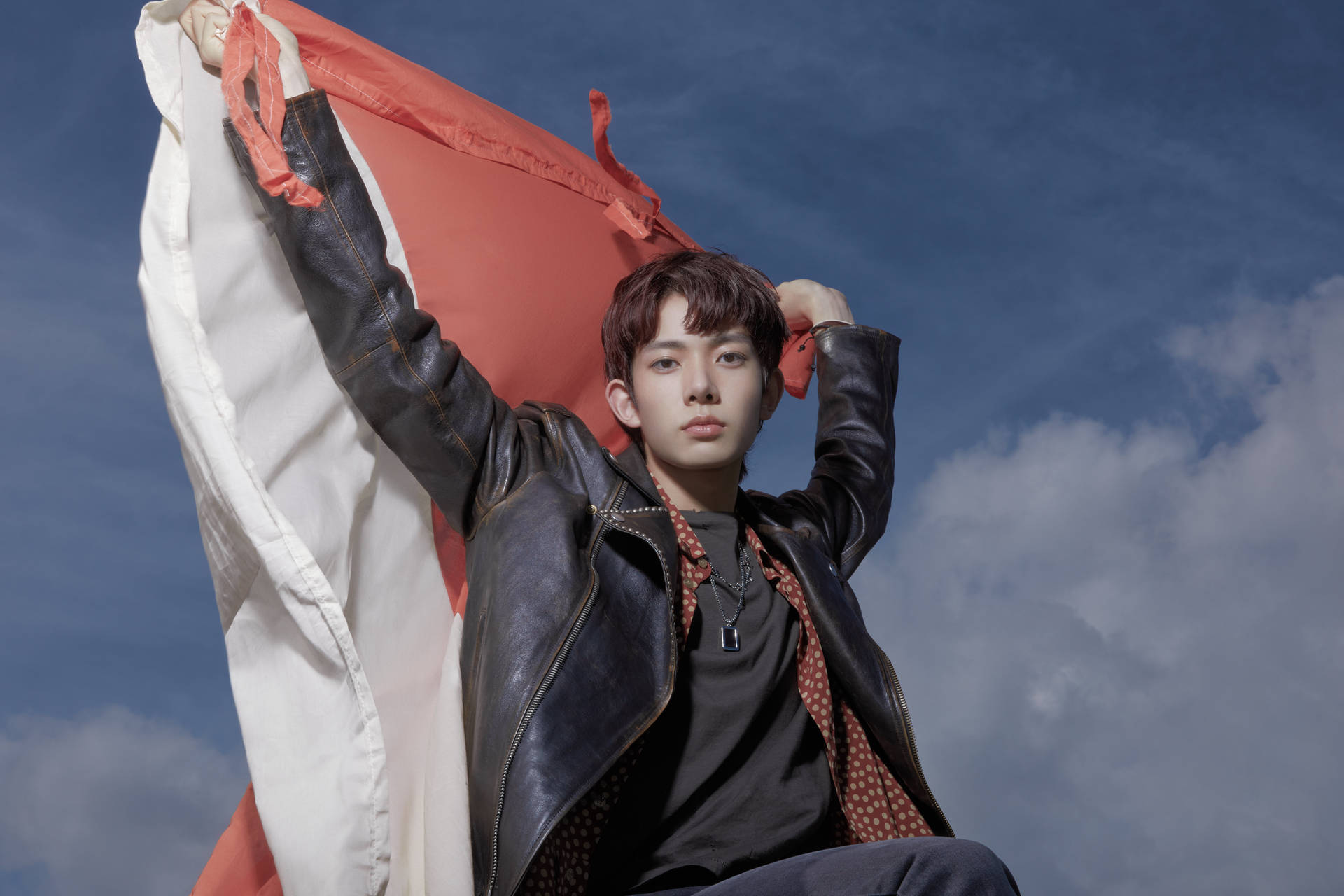 Enhypen Member Heeseung With Cloth Flag Background