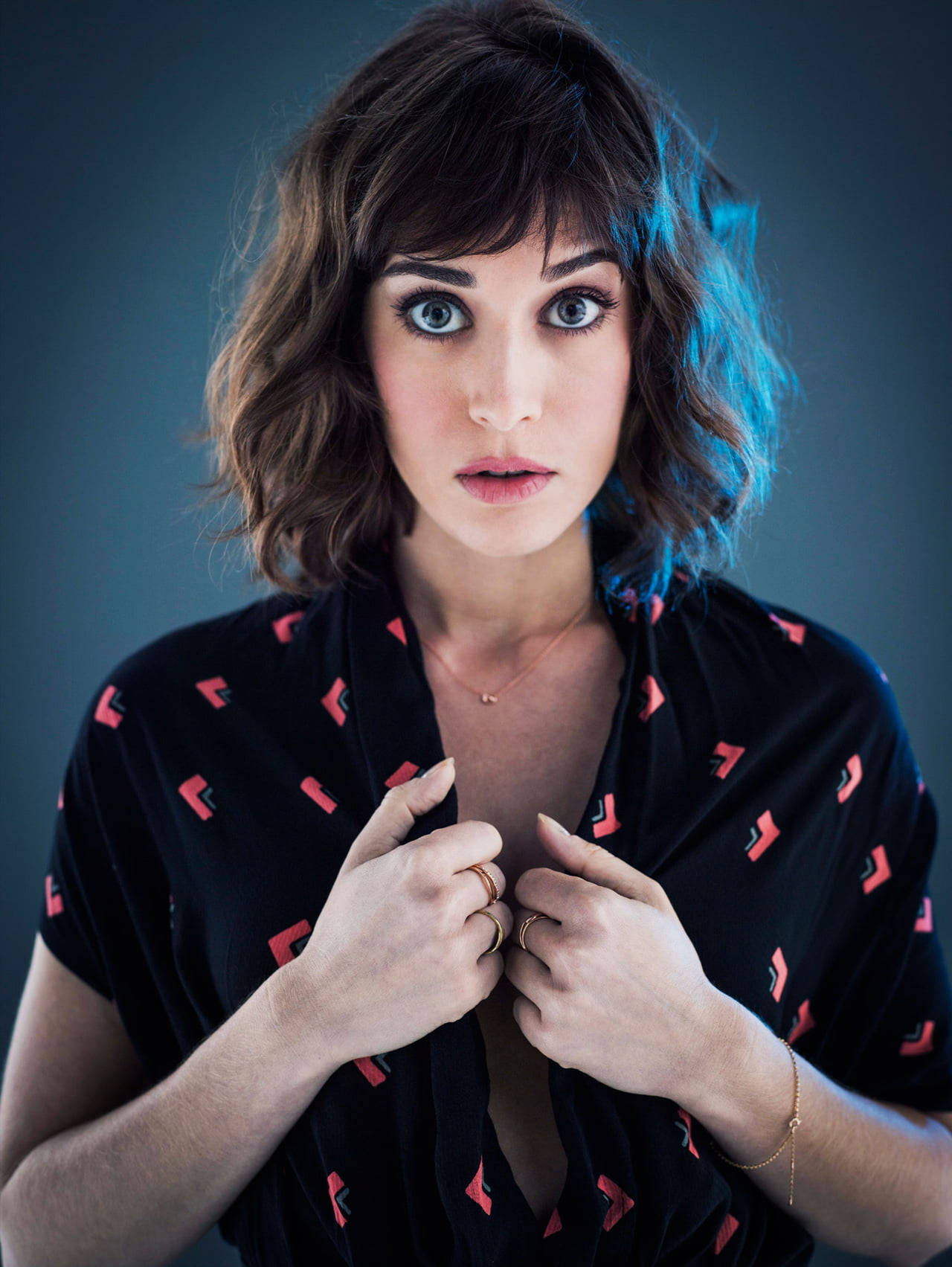 Enigmatic Actress - Lizzy Caplan’s Wide-eyed Look Background