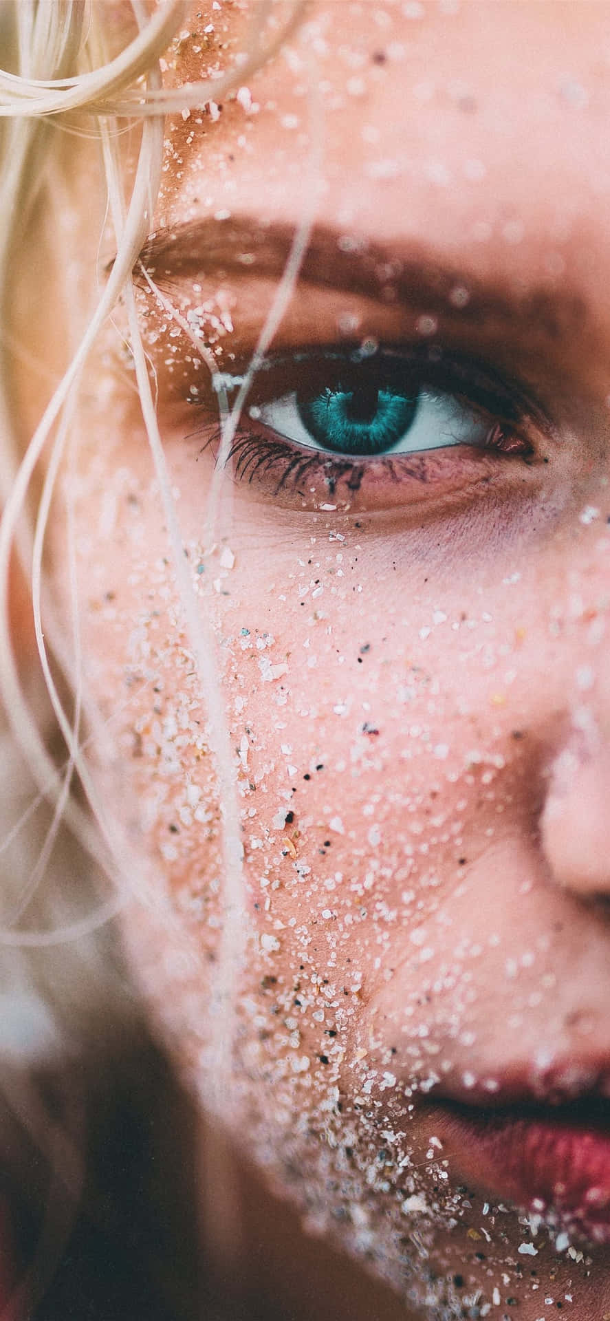 Enigmatic Blonde Woman With Mesmerizing Green Eyes Background