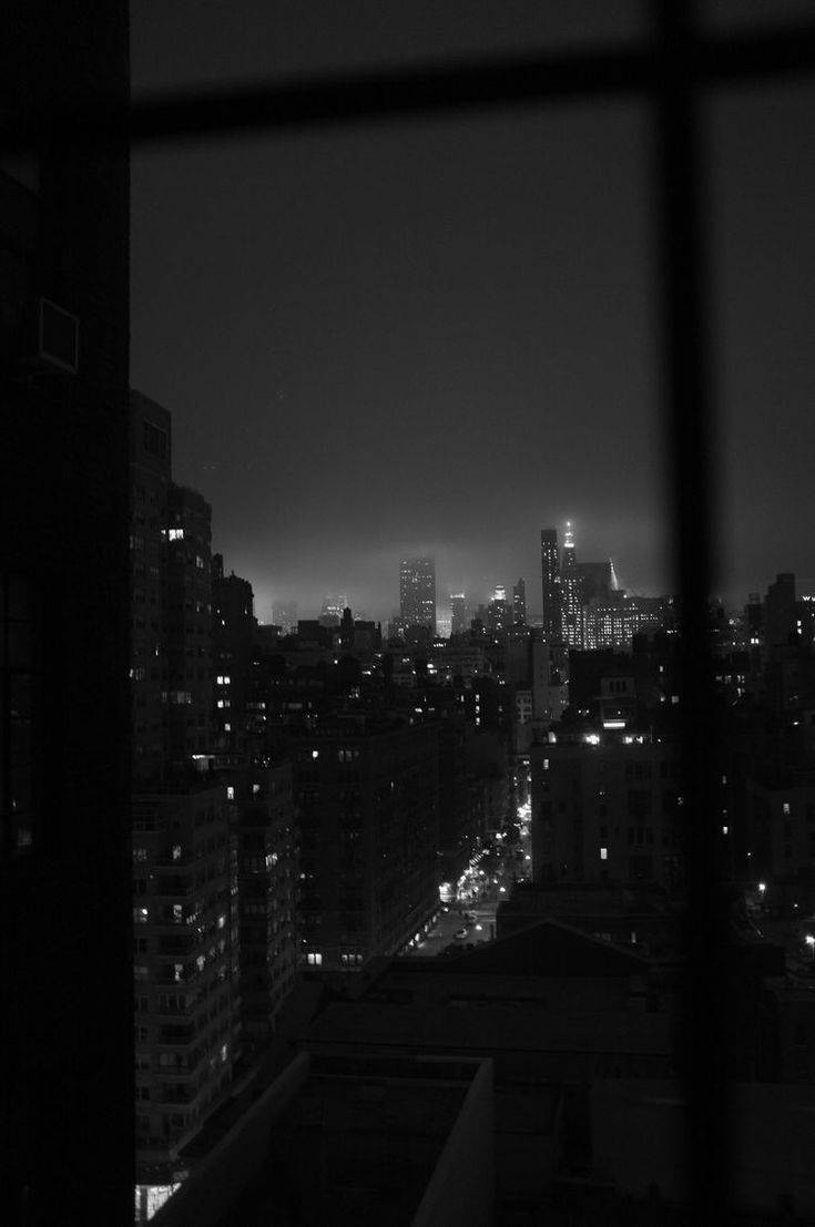 Enigmatic Urban Nightlife In Monochrome Background