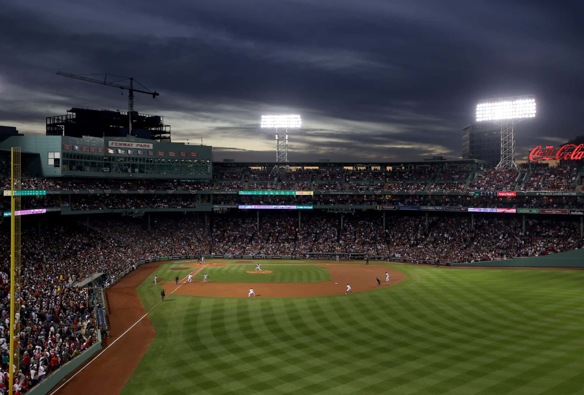 Enjoy A Baseball Game In The Iconic Fenway Park Background