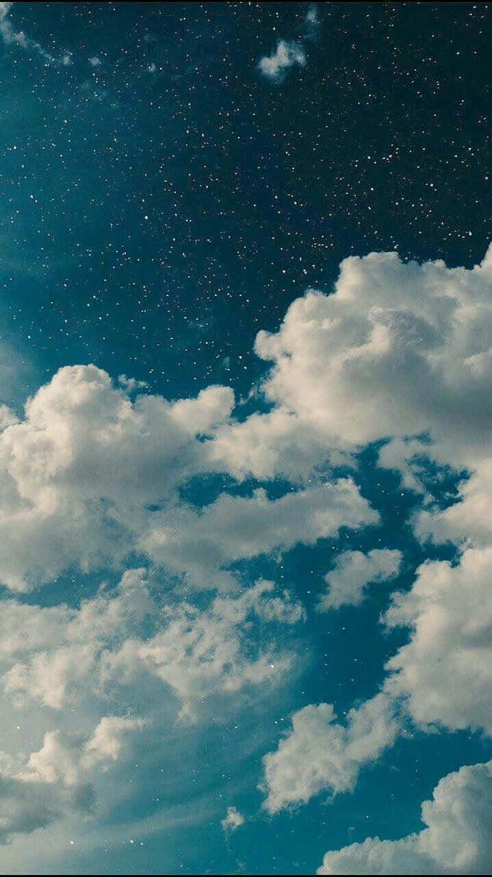 Enjoy A Beautiful Quiet Moment As The Clouds Drift By Background