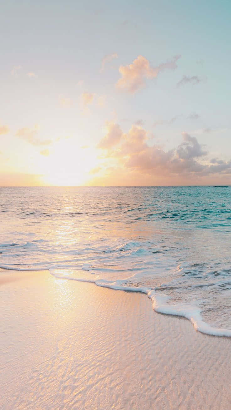 Enjoy A Beautiful Sunset At Pastel Beach Background