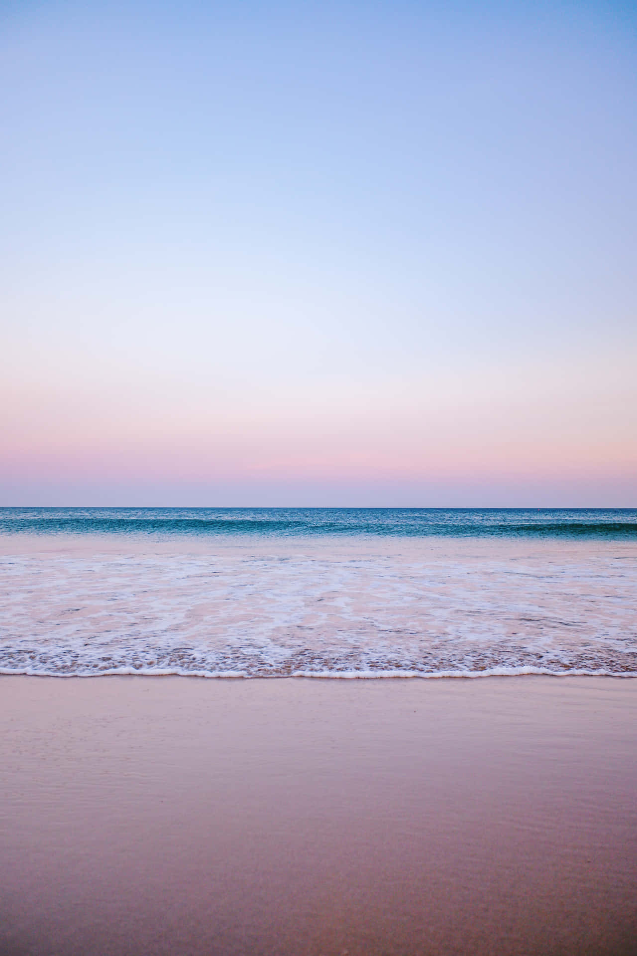 Enjoy A Blissful Day Of Rest And Relaxation At The Tranquil Pastel Beach. Background