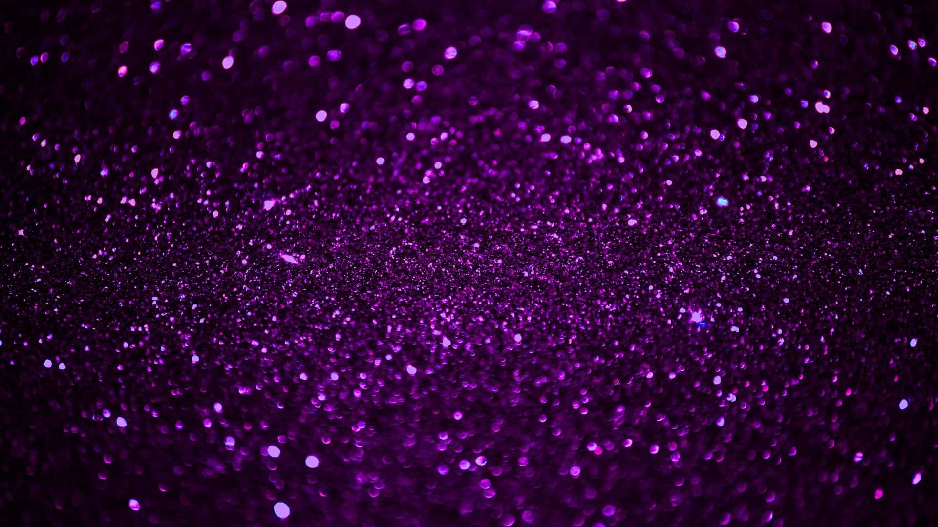 Enjoy A Dazzling Display Of Purple Glitter Background