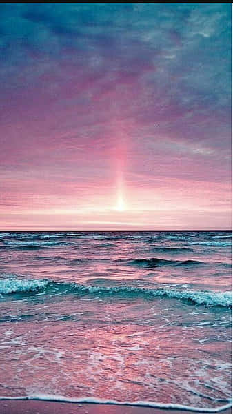 Enjoy A Peaceful Day At The Beach With A Pink Beach Aesthetic Background