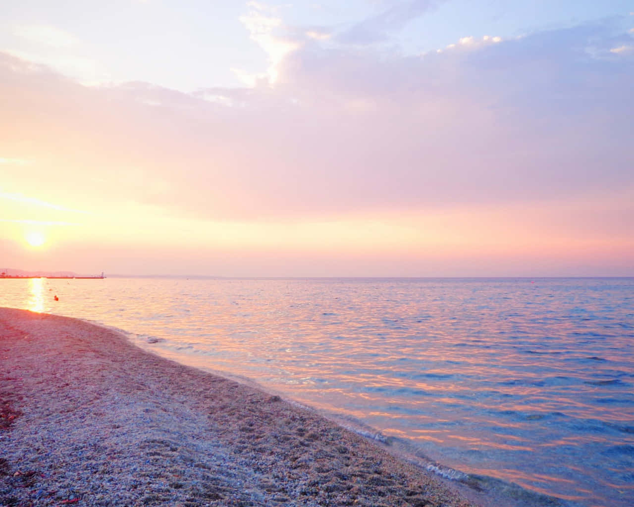 Enjoy A Tranquil Moment In Pastel Colors At The Beach Background