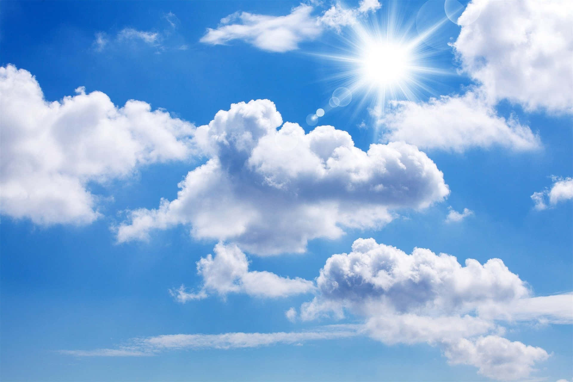 Enjoy An Idyllic View Of White Clouds Against A Blue Sky