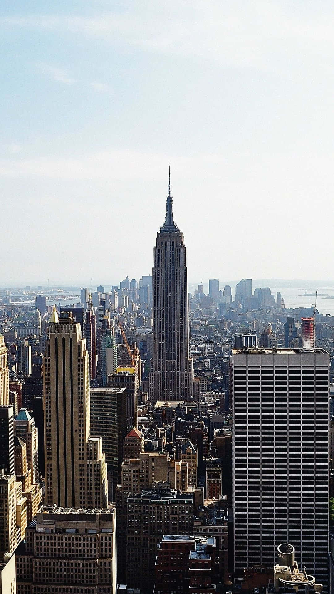 Enjoy Checking Out The City From Your Phone Background