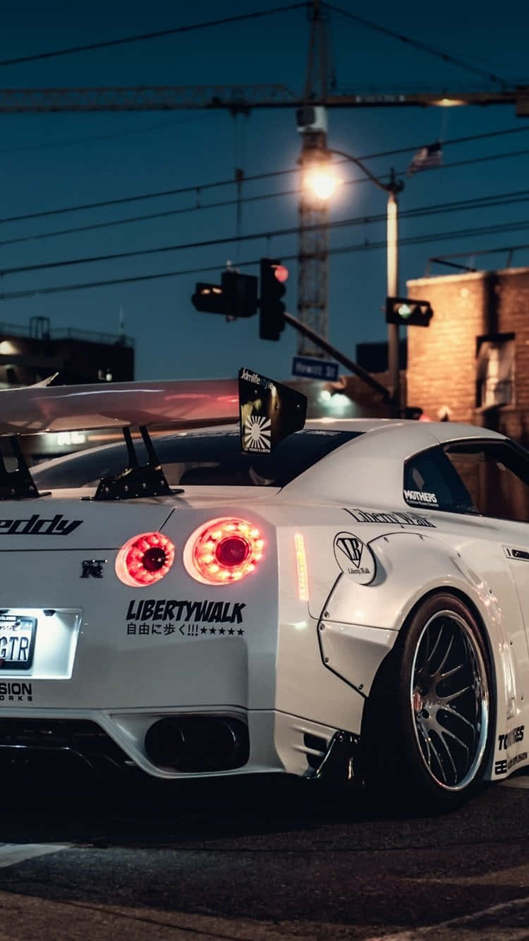 Enjoy Life In Style With The Nissan Skyline For Iphone Background