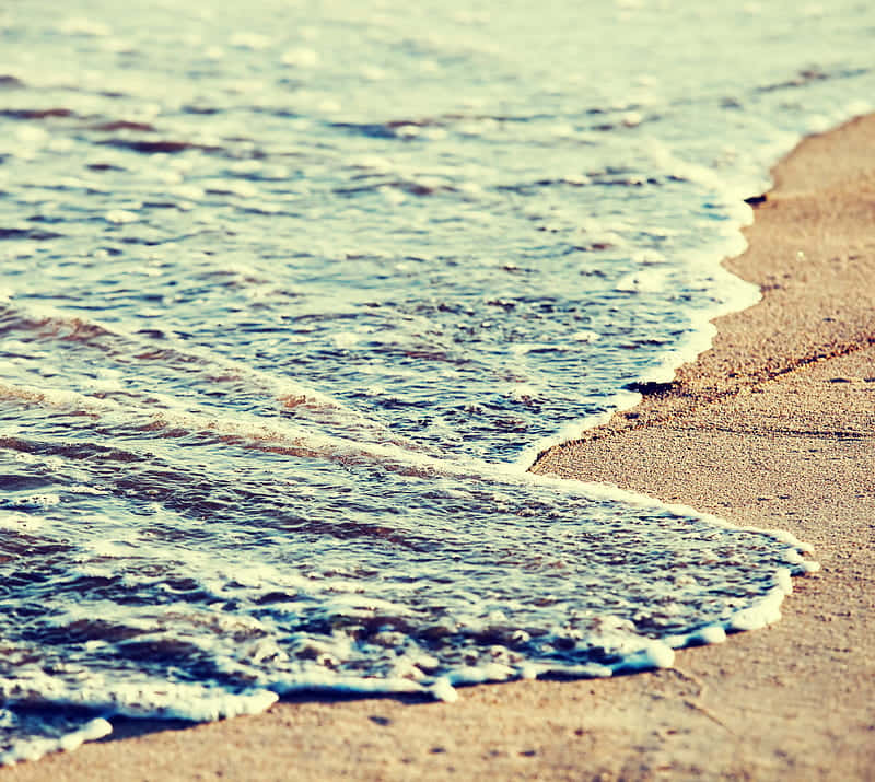 Enjoy The Beautiful Backdrop Of A Retro Beach Background