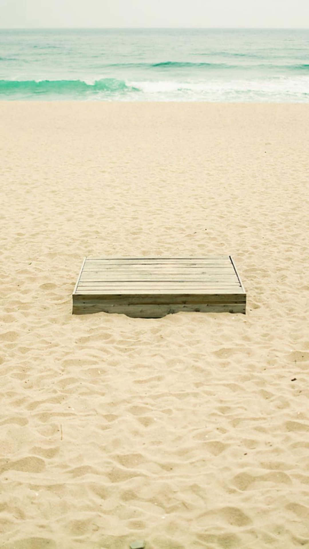 Enjoy The Beauty Of A Peaceful Beach Background