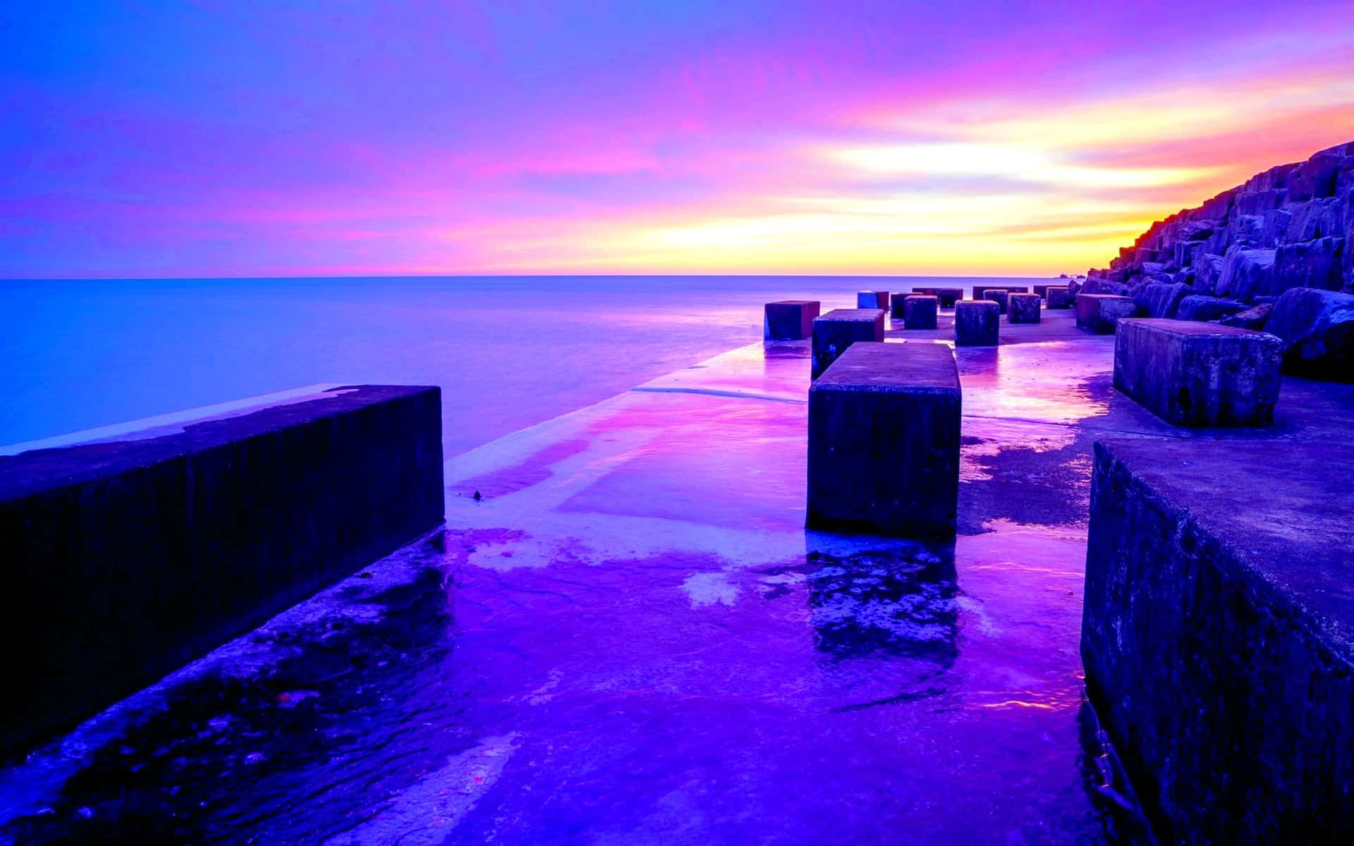 Enjoy The Beauty Of Nature As The Sun Dips Over The Horizon Casting A Beautiful Blue And Purple Sunset. Background