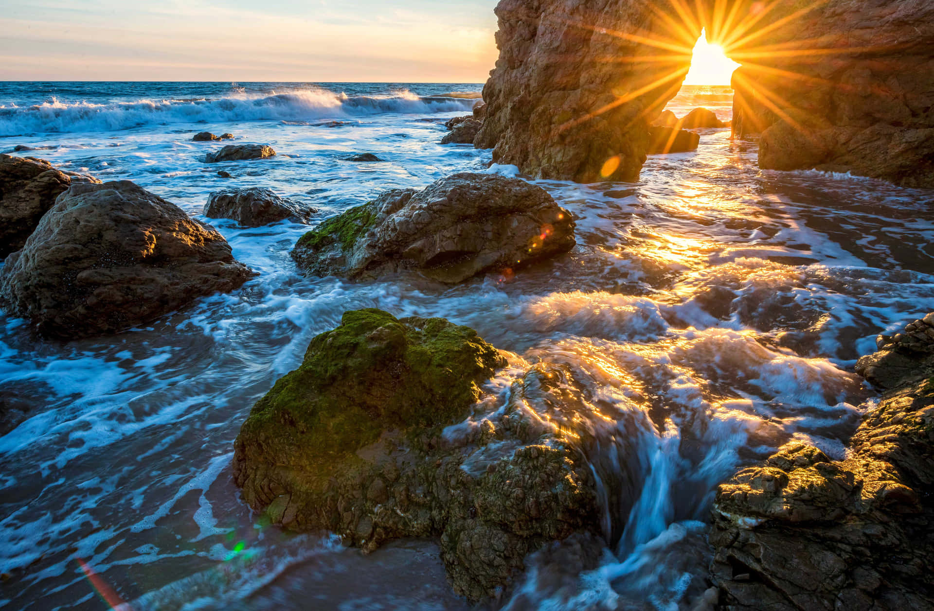 Enjoy The Beauty Of The Malibu Beach Sunrise Background