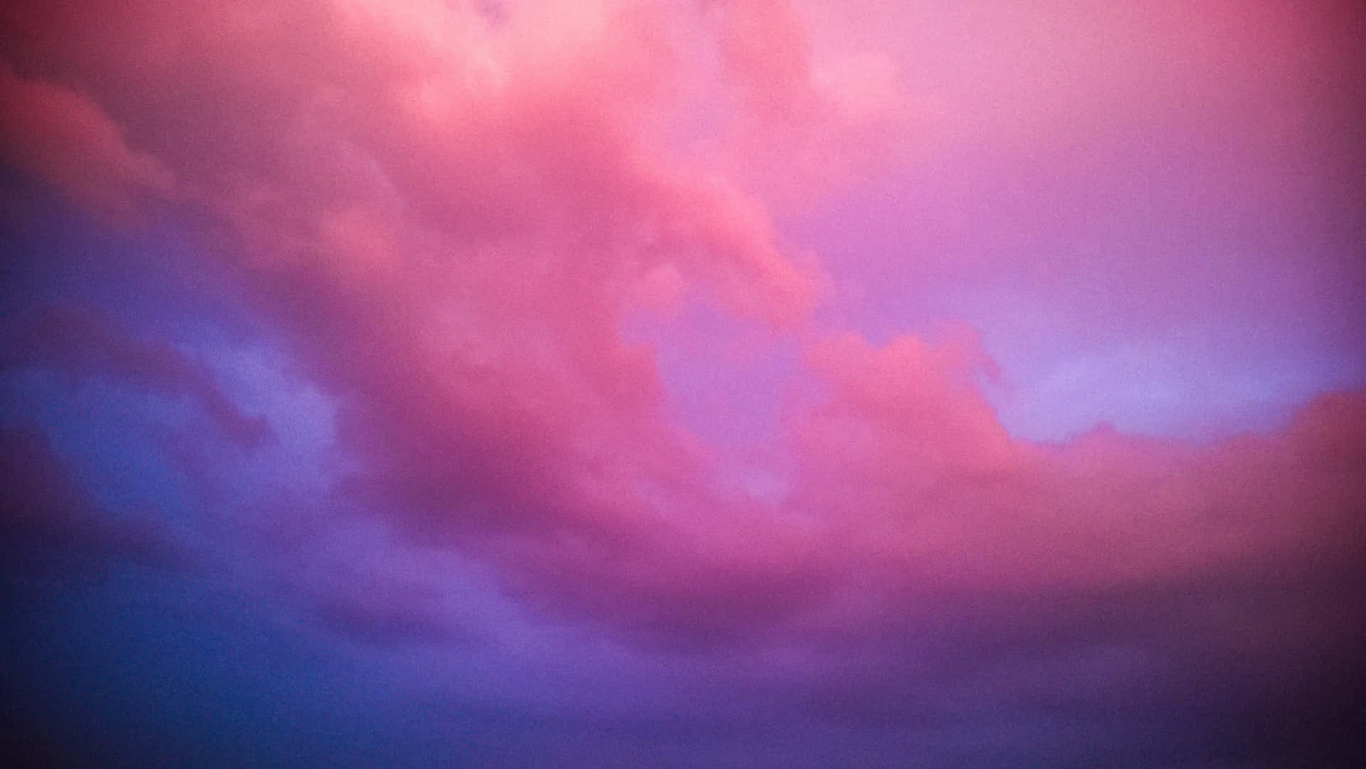 Enjoy The Beauty Of The Sky With Breathtaking Pink And Blue Clouds. Background