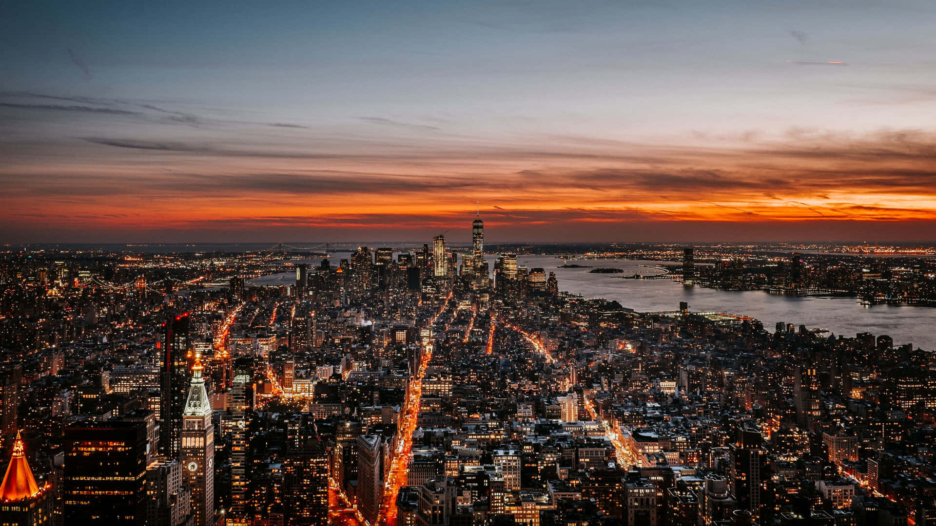 Enjoy The Bustling Beauty Of Nyc At Night Background