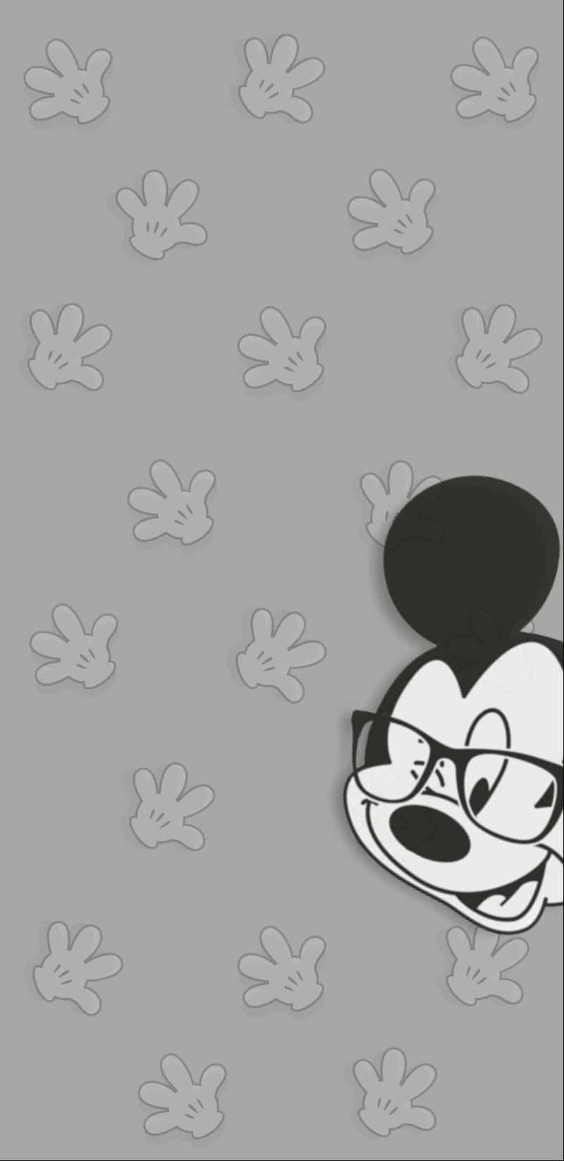 Enjoy The Classic Disney Character Mickey Mouse On Your Phone Background