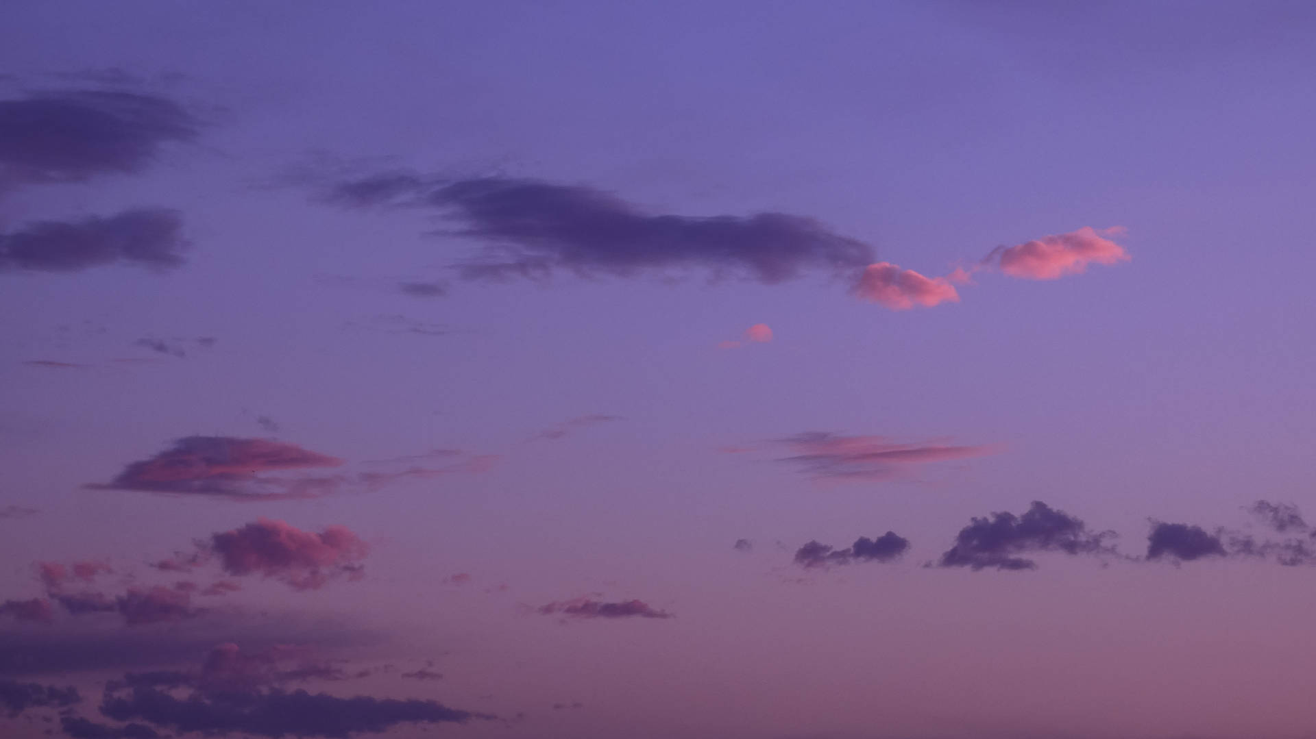 Enjoy The Dreamy Pastel Shades Of The Ombre Cloudy Purple Sky Background