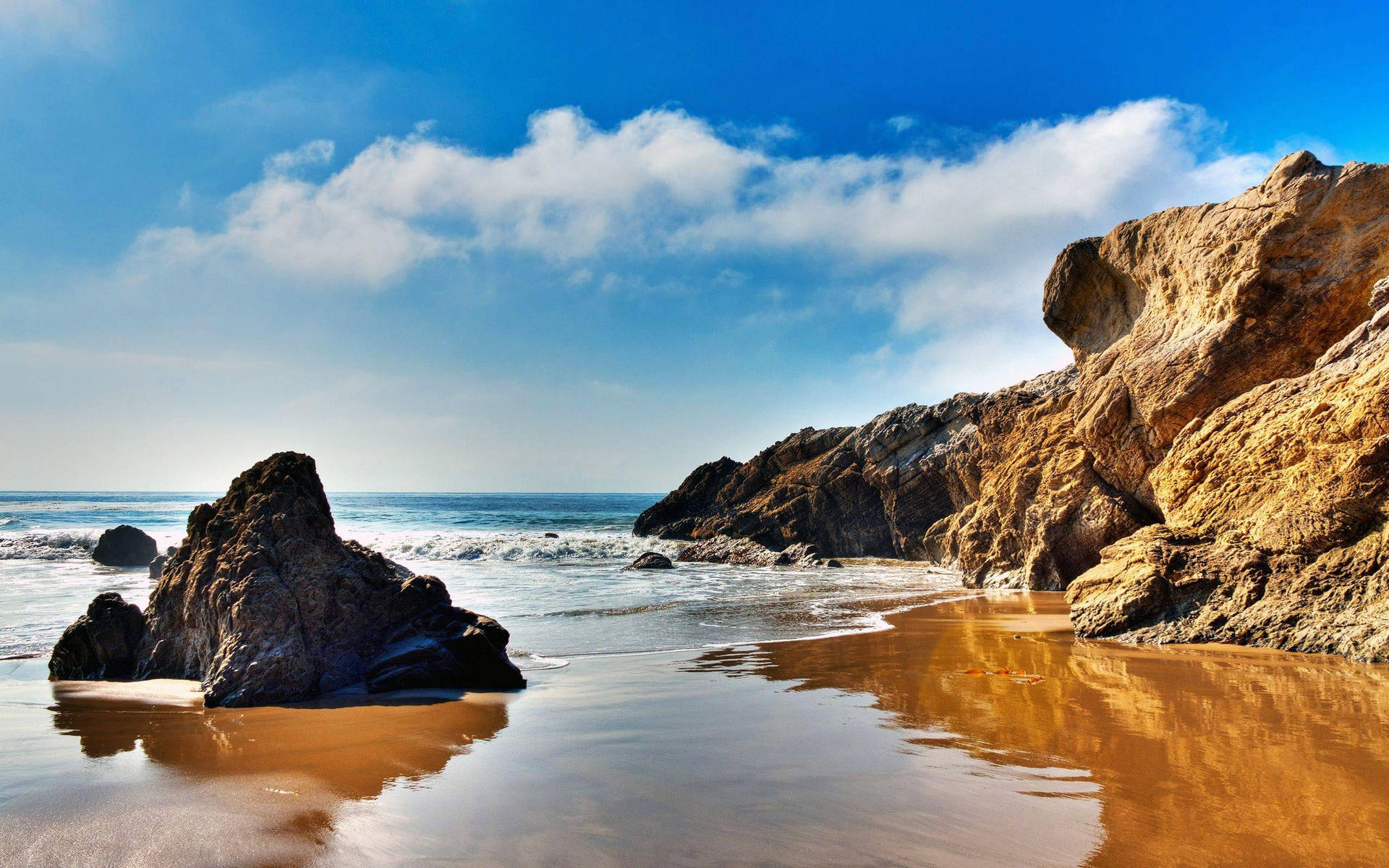 Enjoy The Golden Sunrise In Malibu Background